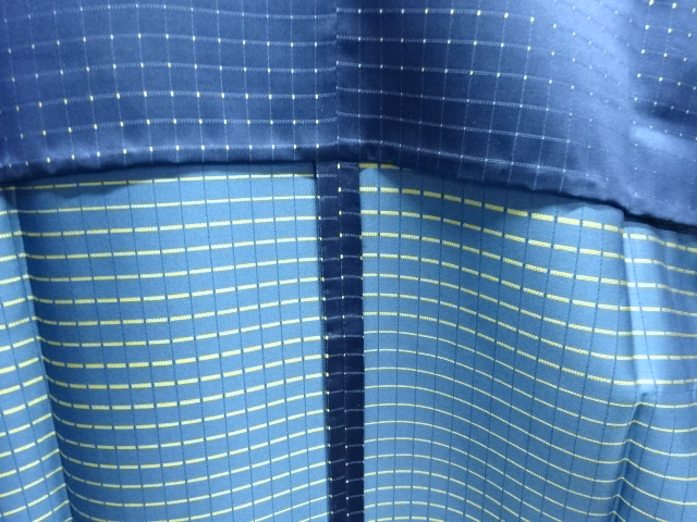  格子織り出し雨コート